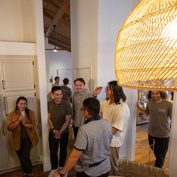 Members talking and laughing before a meeting starts
